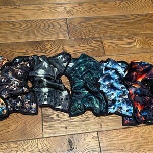 Cloth diaper covers and pockets